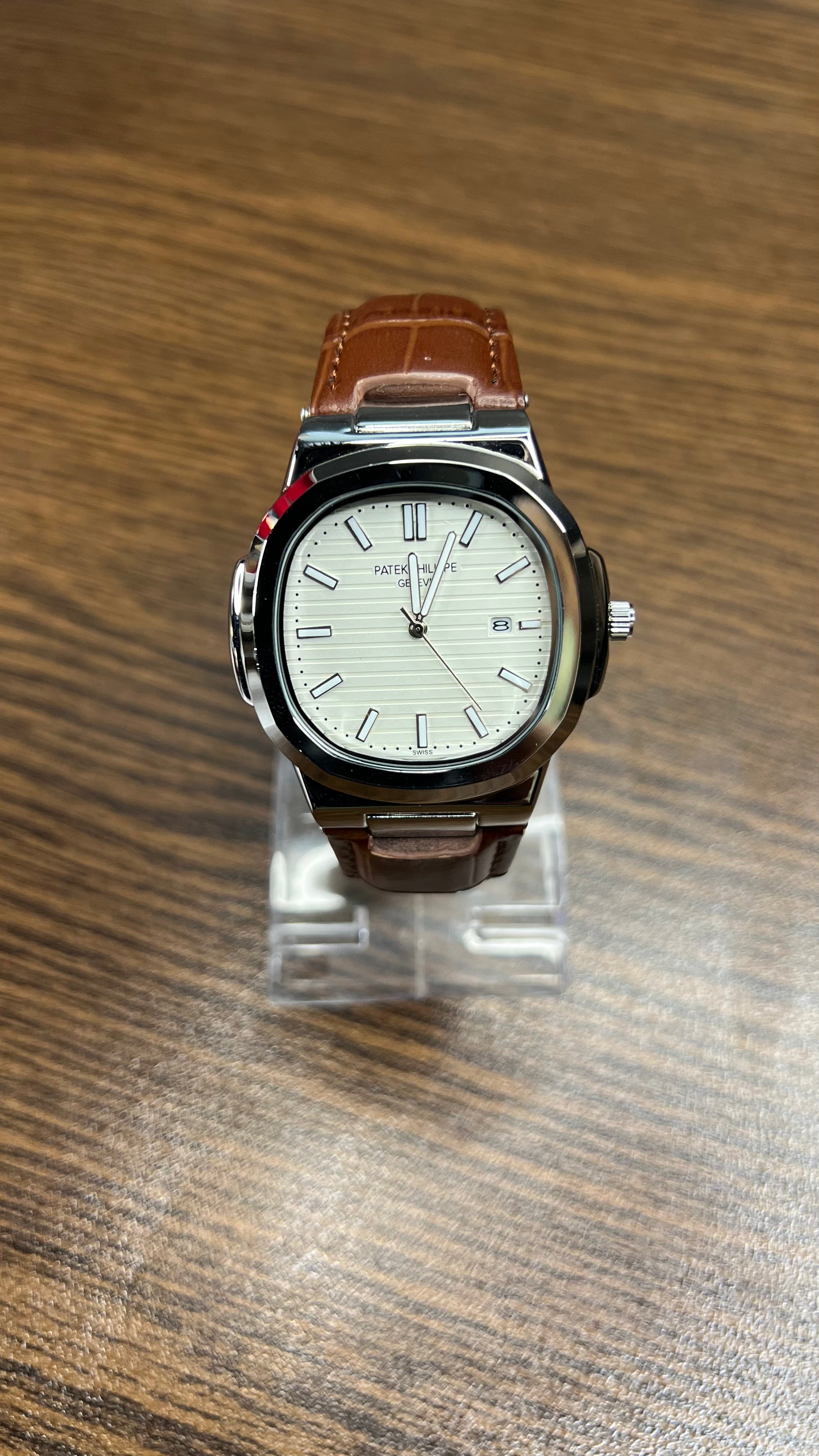 Patek Philippe Nautilus Stainless Steel & Black Leather Strap – Black Dial with Date Display