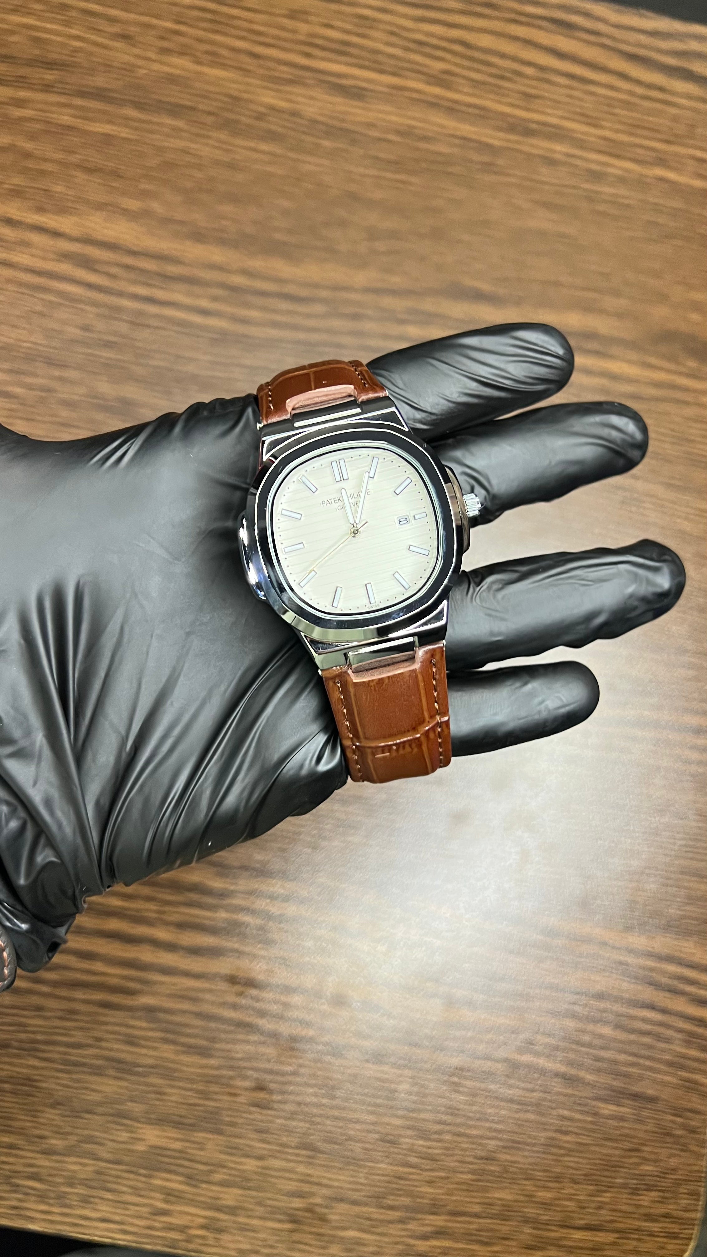 Patek Philippe Nautilus Stainless Steel & Black Leather Strap – Black Dial with Date Display