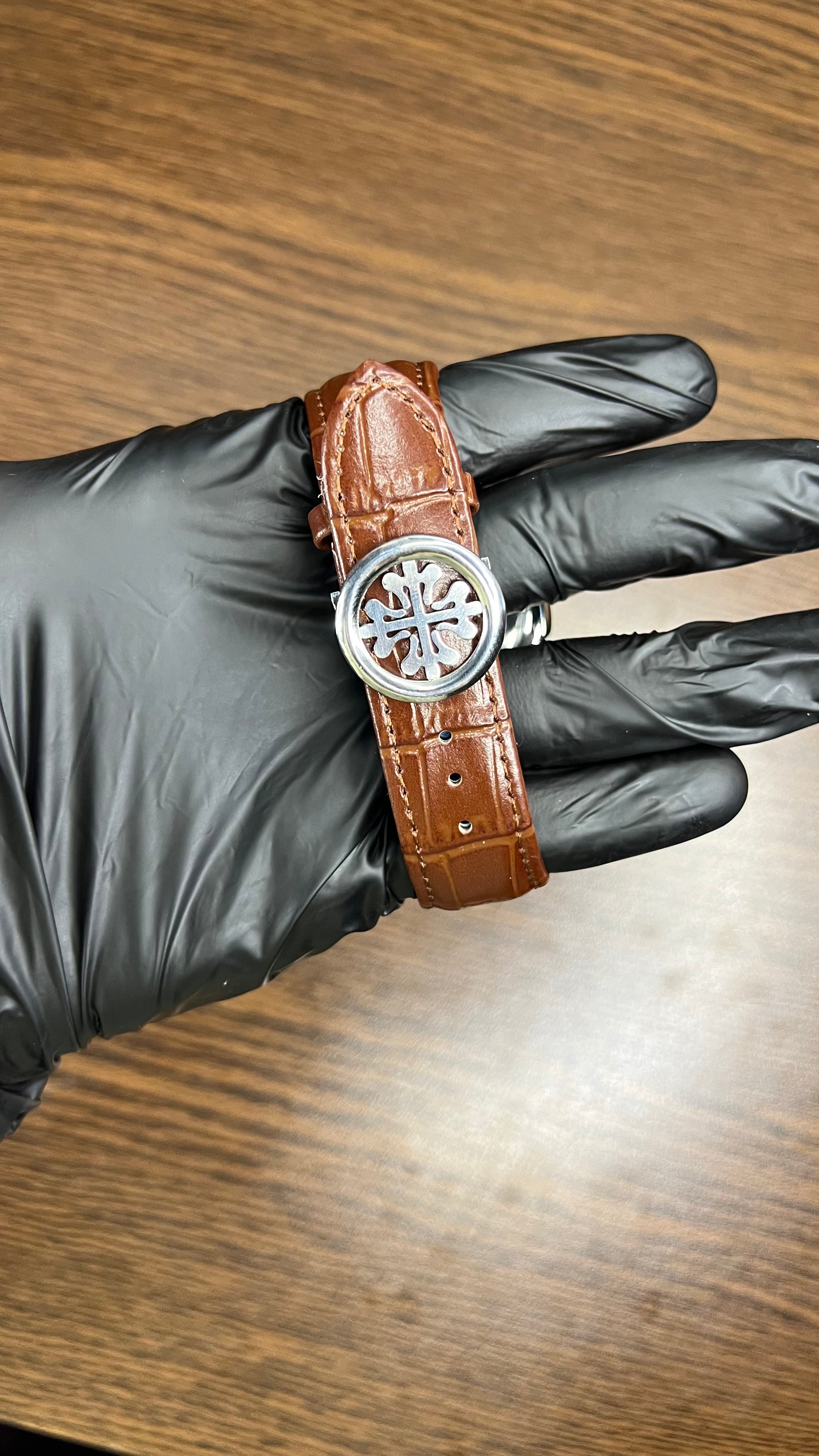 Patek Philippe Nautilus Stainless Steel & Black Leather Strap – Black Dial with Date Display