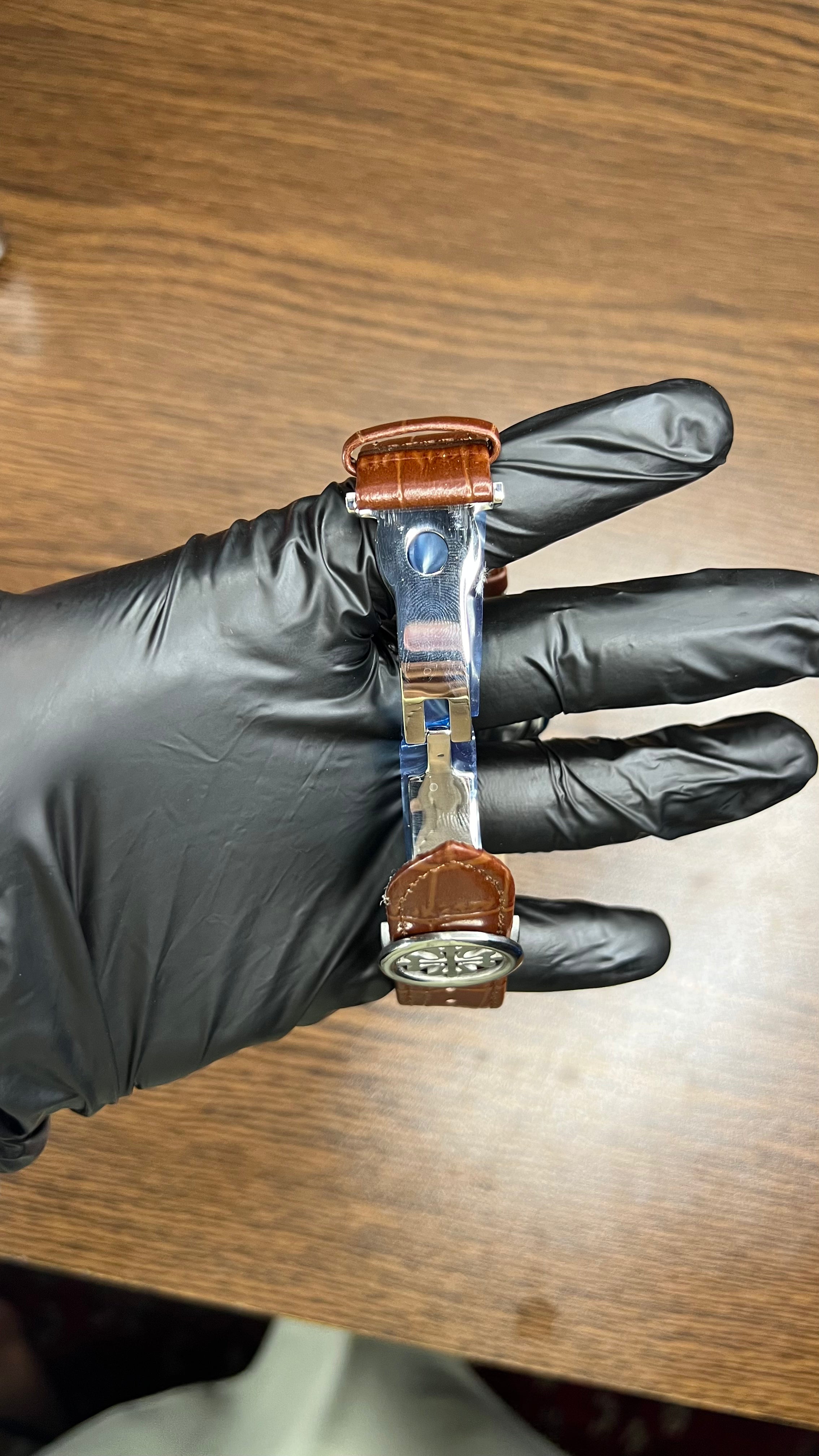 Patek Philippe Nautilus Stainless Steel & Black Leather Strap – Black Dial with Date Display