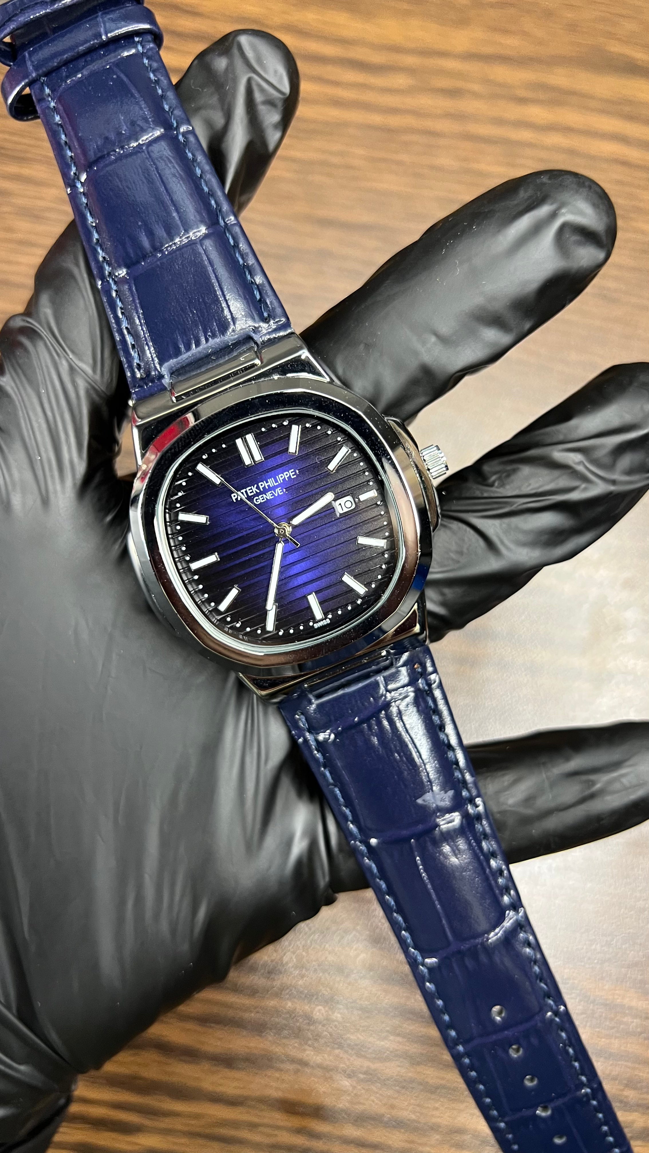 Patek Philippe Nautilus Stainless Steel & Black Leather Strap – Black Dial with Date Display