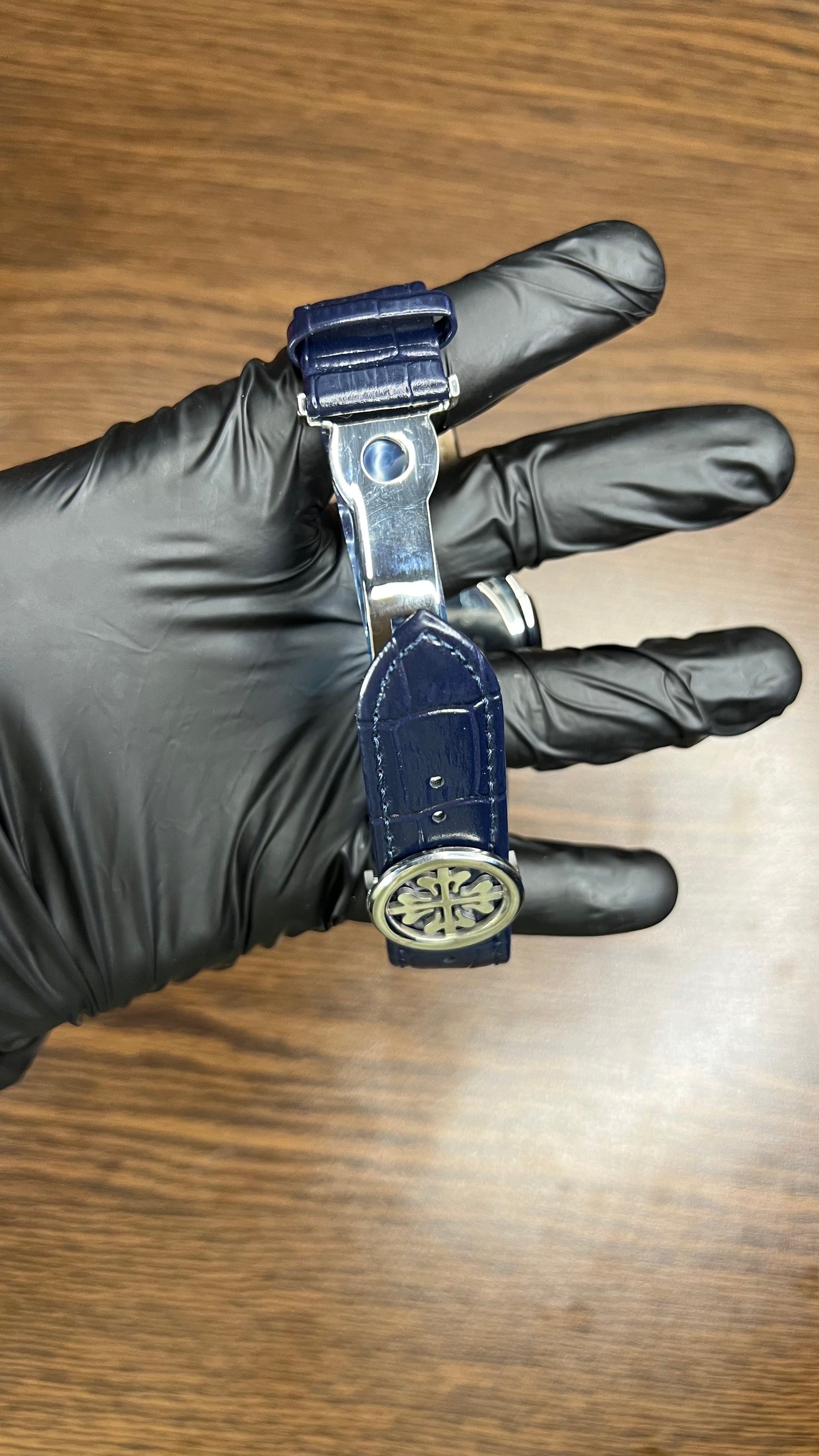 Patek Philippe Nautilus Stainless Steel & Black Leather Strap – Black Dial with Date Display