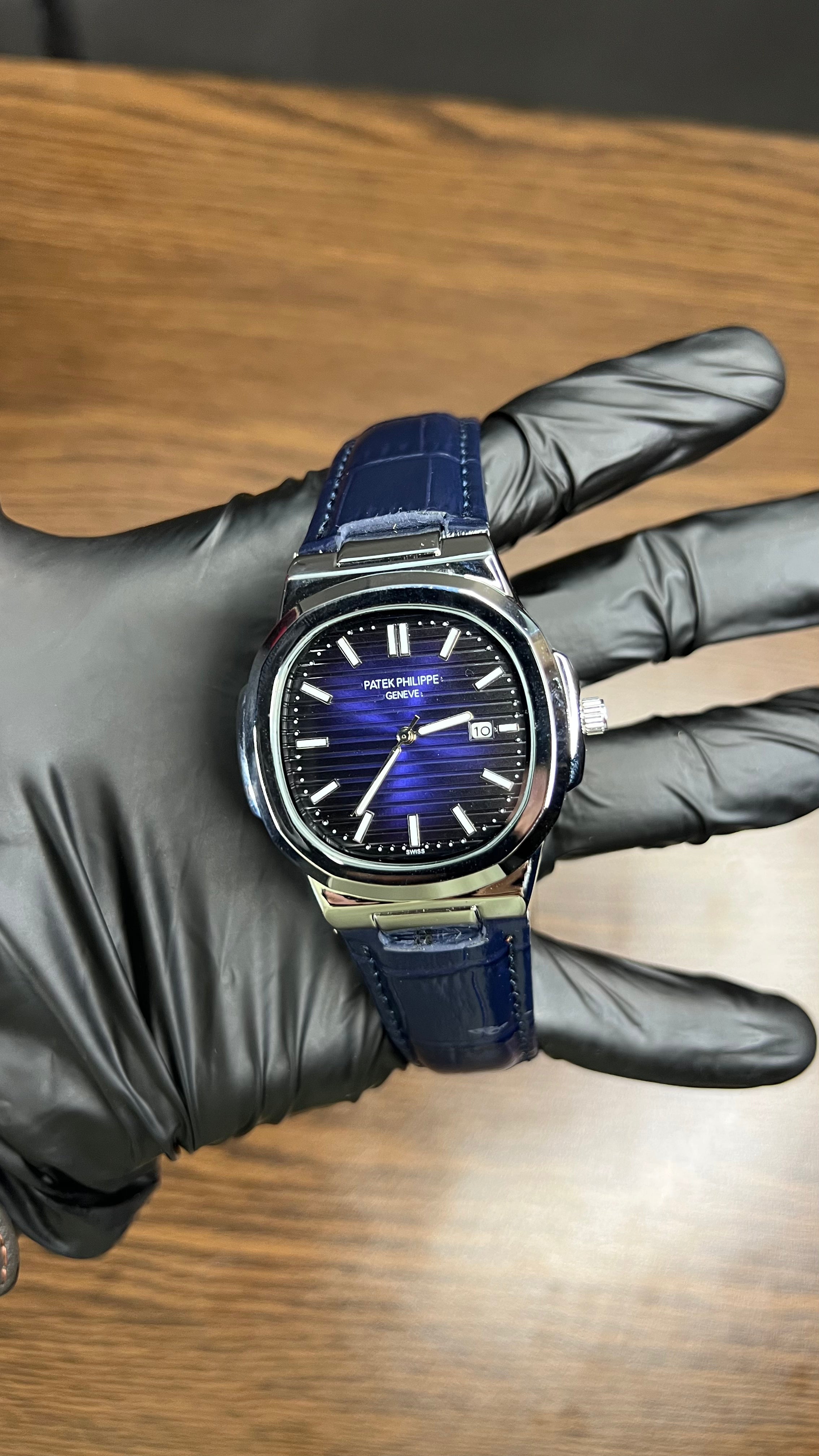 Patek Philippe Nautilus Stainless Steel & Black Leather Strap – Black Dial with Date Display