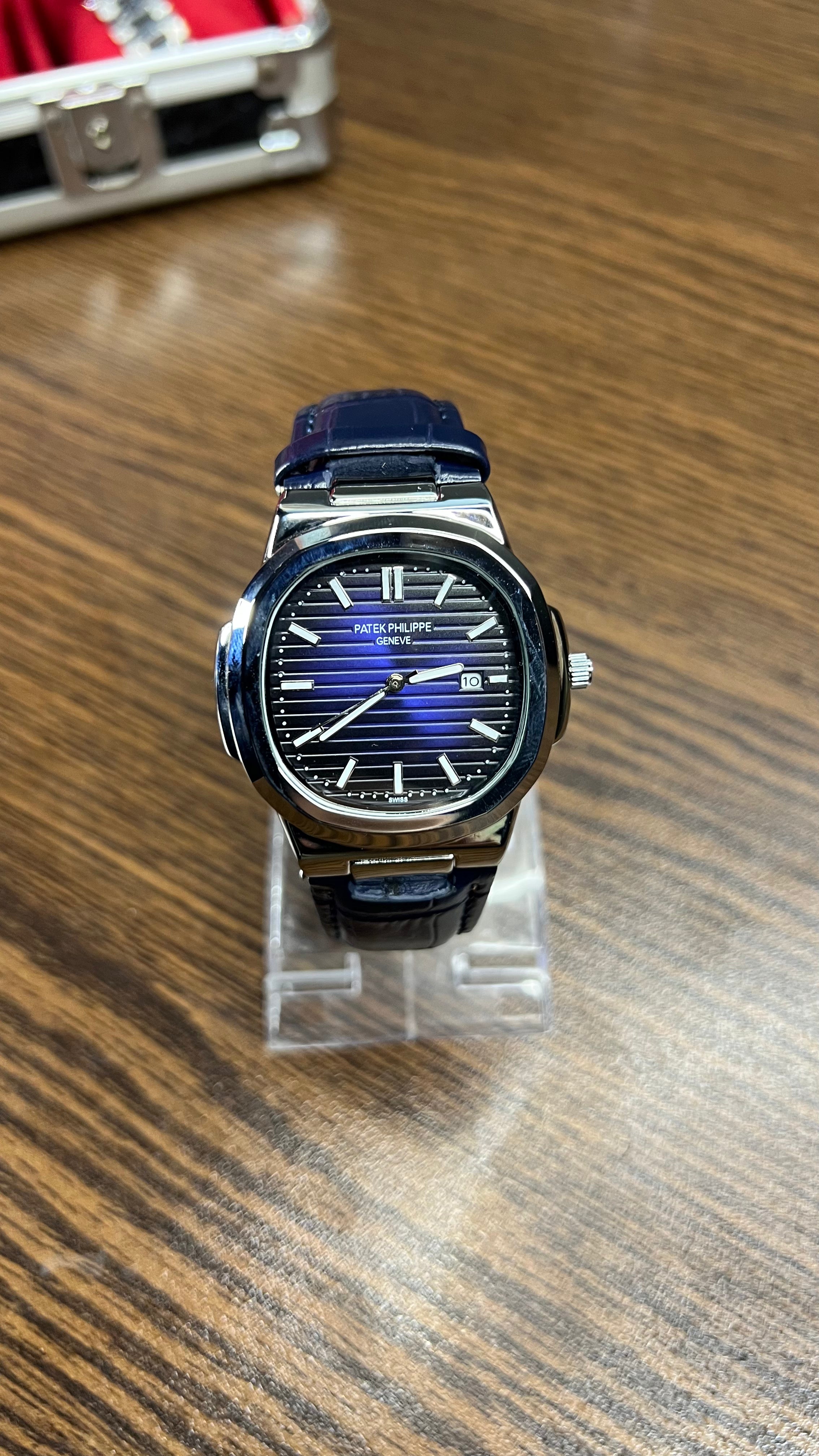 Patek Philippe Nautilus Stainless Steel & Black Leather Strap – Black Dial with Date Display